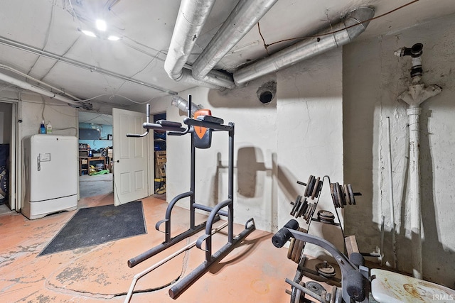 exercise room featuring washer / dryer