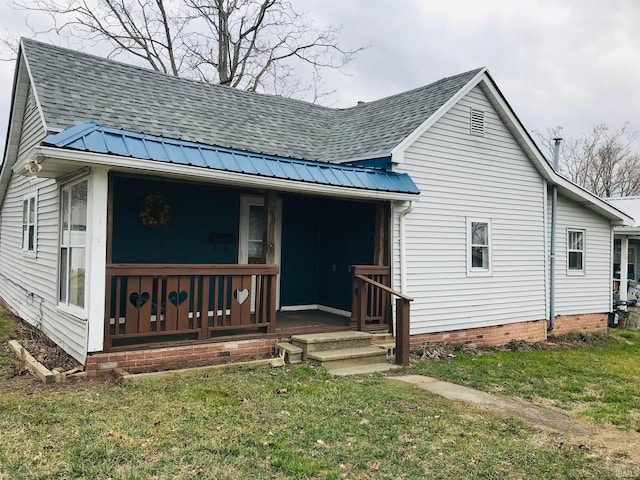 view of front of property with a front yard and a porch