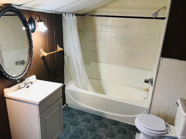 full bathroom featuring shower / bath combo with shower curtain, tile floors, toilet, and vanity