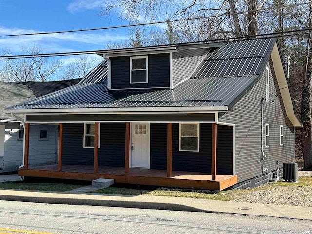 view of front of house with central AC and a porch