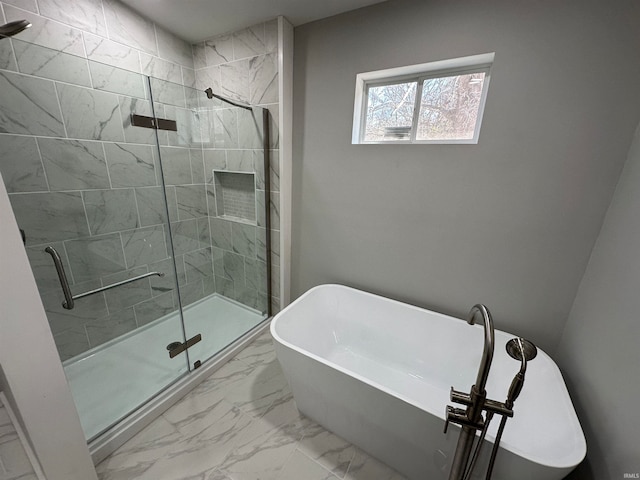 bathroom with shower with separate bathtub