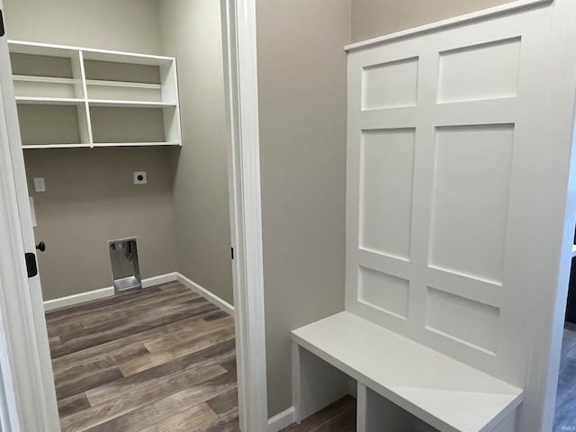 clothes washing area with laundry area, baseboards, dark wood-type flooring, and hookup for an electric dryer