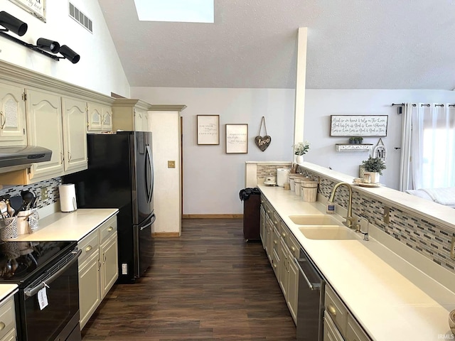 kitchen with range with electric stovetop, dark wood-type flooring, dishwasher, sink, and vaulted ceiling