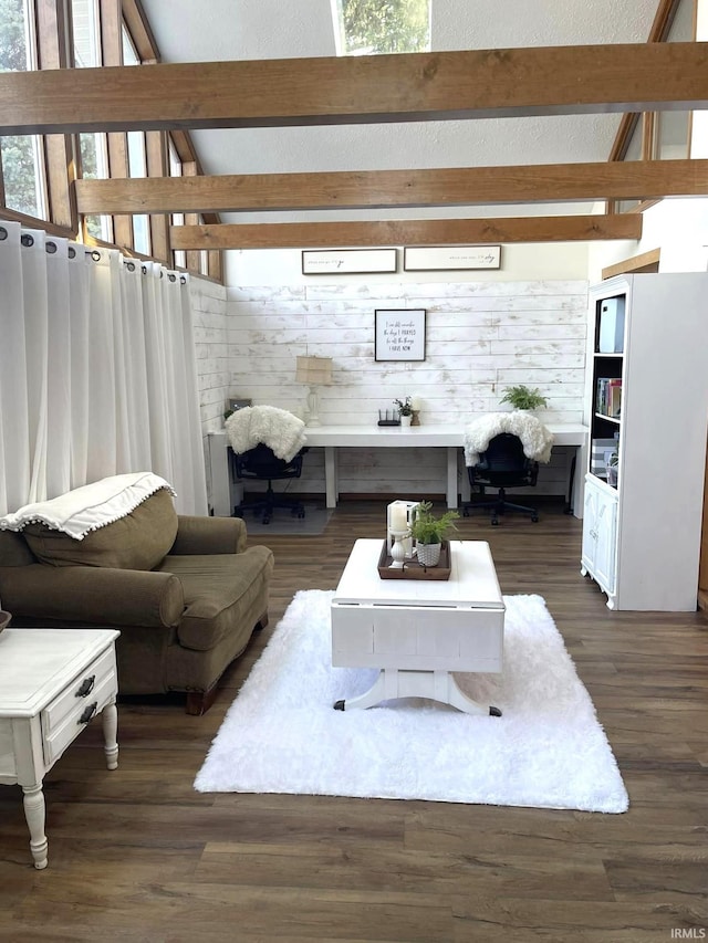 living room featuring beam ceiling and dark hardwood / wood-style flooring