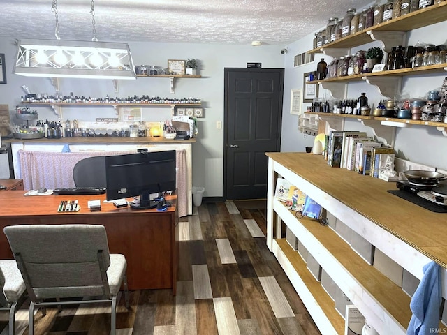 interior space featuring dark hardwood / wood-style flooring and a textured ceiling