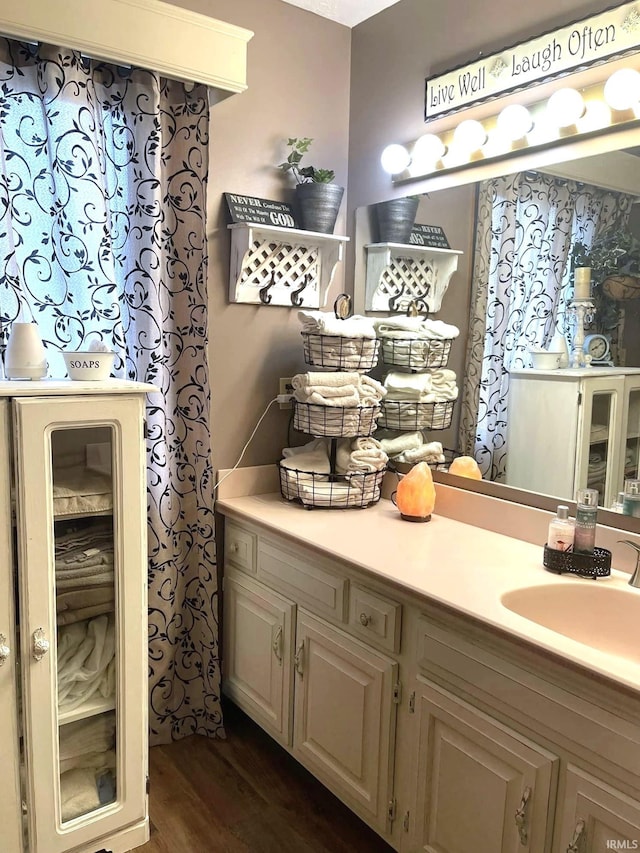 bathroom with vanity and hardwood / wood-style floors