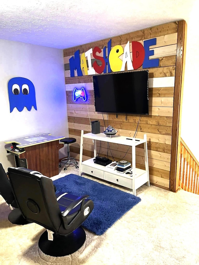 interior space featuring wooden walls and a textured ceiling