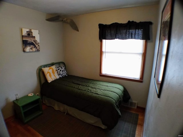 bedroom featuring dark hardwood / wood-style flooring