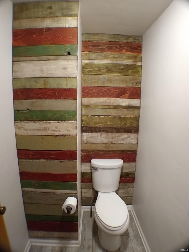 bathroom featuring toilet and hardwood / wood-style floors