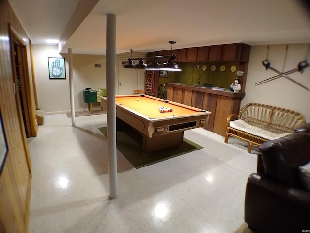 game room featuring bar area and billiards