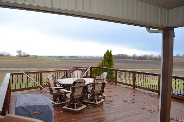 wooden deck featuring a rural view