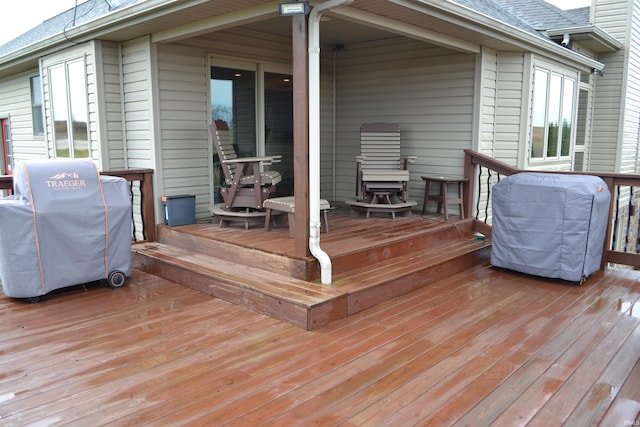 wooden terrace featuring grilling area