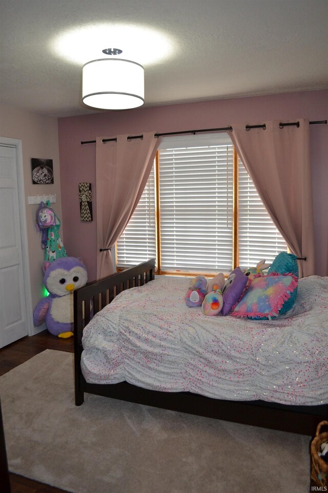 bedroom with multiple windows