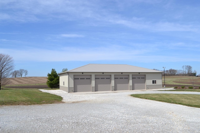 view of front of home featuring an outdoor structure and a garage