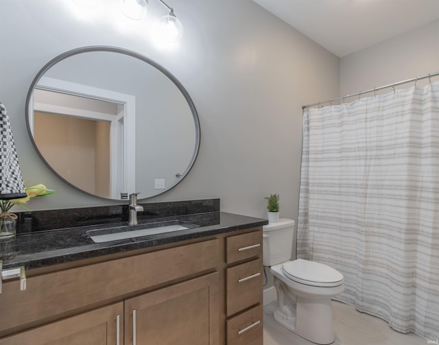 bathroom featuring vanity, toilet, and tile patterned floors