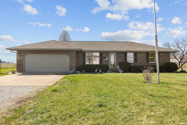 ranch-style house featuring a front yard and a garage