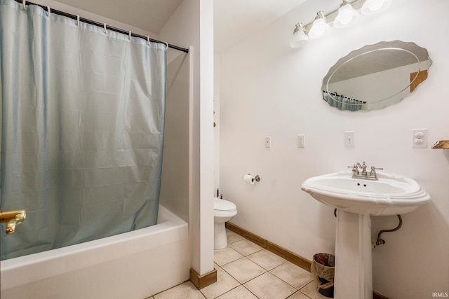 bathroom with toilet, shower / bath combo with shower curtain, and tile flooring