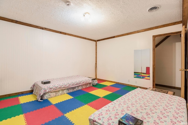 bedroom featuring a textured ceiling