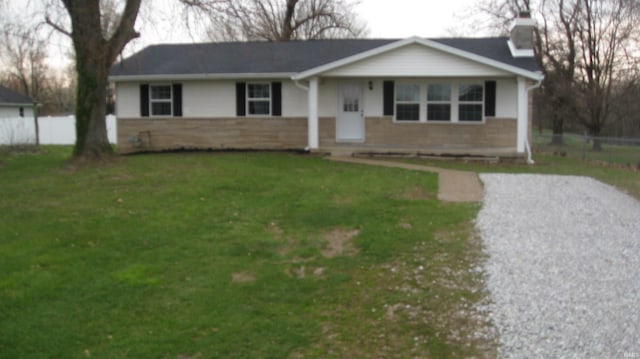 ranch-style home with a front lawn