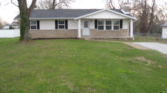 single story home featuring a front lawn