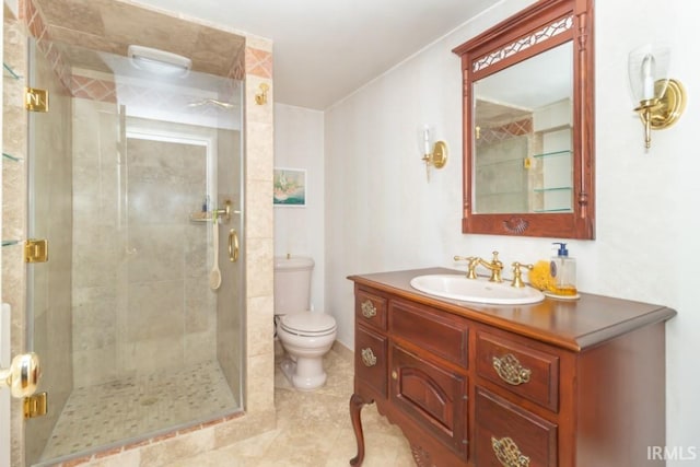 bathroom featuring tile flooring, toilet, an enclosed shower, and vanity with extensive cabinet space