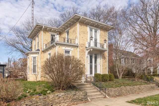 italianate-style house with a balcony