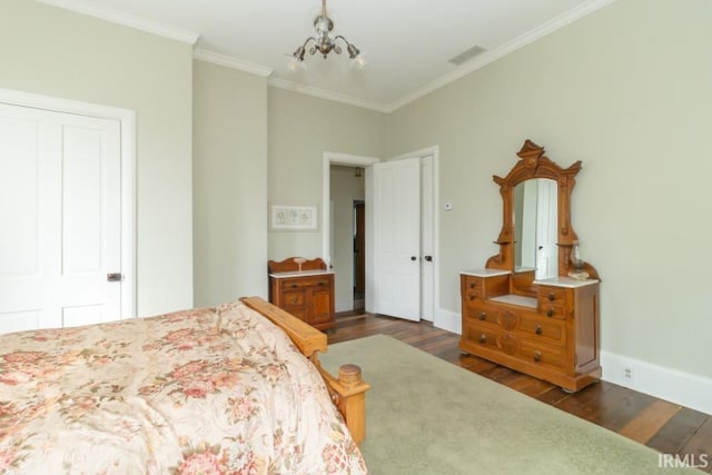 bedroom featuring a chandelier, a closet, ornamental molding, and dark wood-type flooring