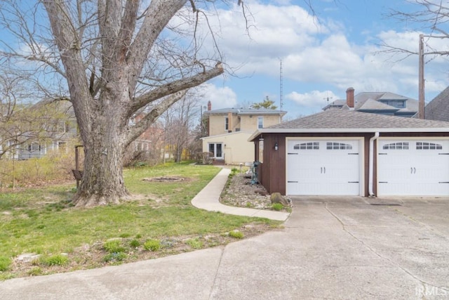 view of front of house with a front yard and a garage