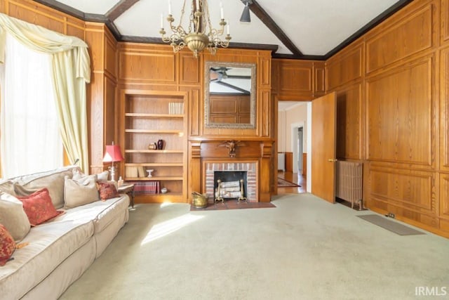 carpeted living room featuring plenty of natural light, a brick fireplace, an inviting chandelier, and beamed ceiling