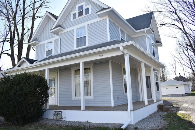 view of front of property featuring a porch and a garage