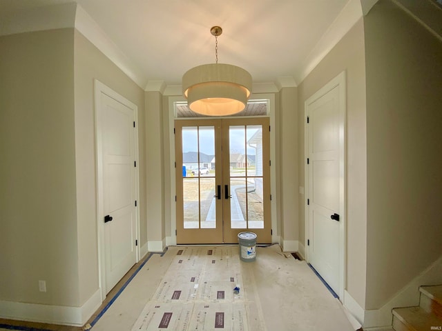 entryway with french doors and crown molding