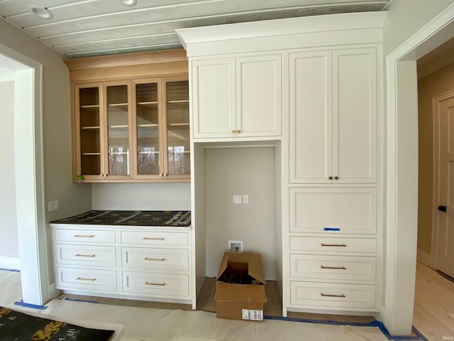 kitchen featuring white cabinetry and light hardwood / wood-style floors