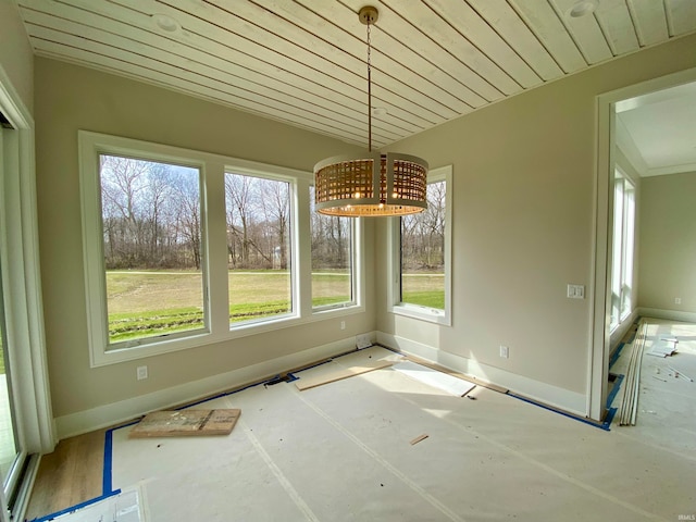 unfurnished dining area featuring plenty of natural light