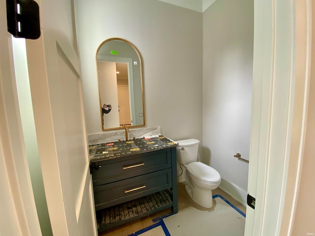 bathroom featuring oversized vanity and toilet