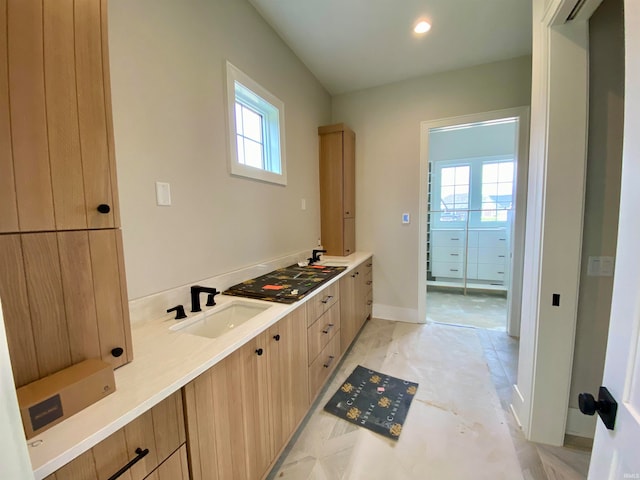 bathroom featuring tile floors, plenty of natural light, and vanity