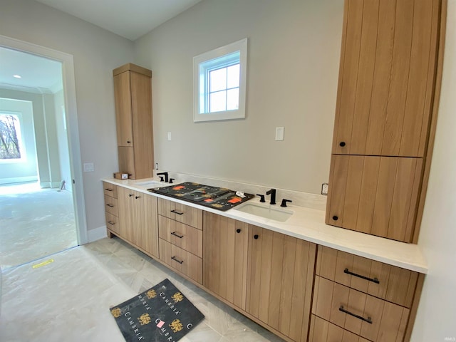 bathroom with tile flooring and sink