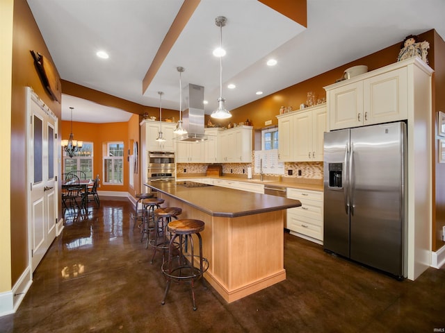 kitchen featuring range hood, backsplash, stainless steel appliances, an inviting chandelier, and a center island