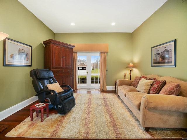 living room featuring french doors and light wood-type flooring