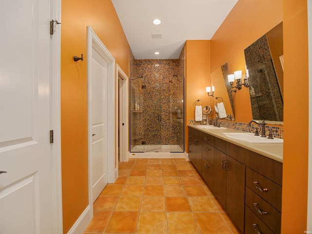 bathroom featuring tile floors, vanity, and an enclosed shower