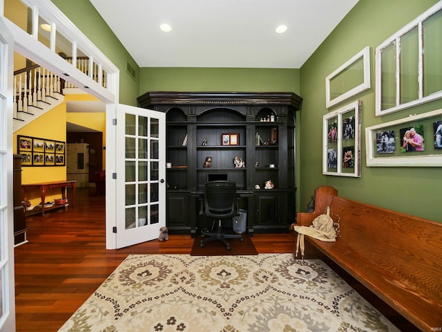 sitting room with dark wood-type flooring