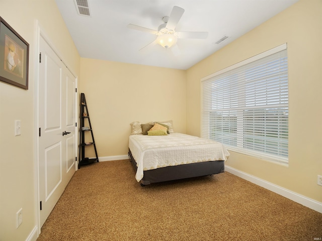 carpeted bedroom with ceiling fan