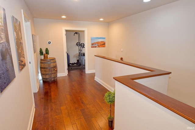 hall with dark hardwood / wood-style flooring