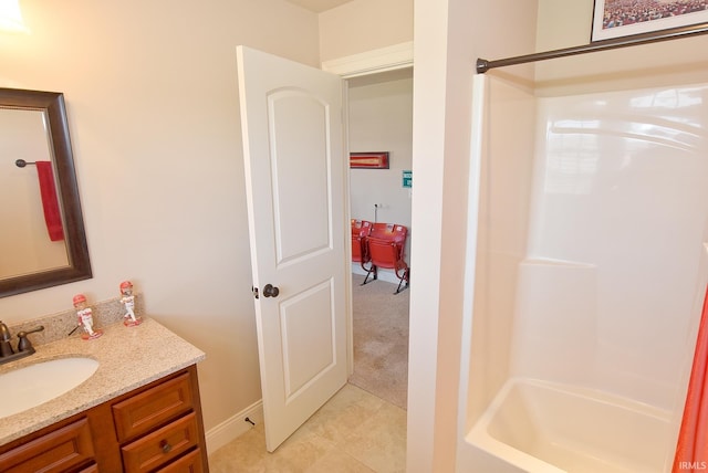 bathroom featuring tile floors, shower / bathing tub combination, and vanity