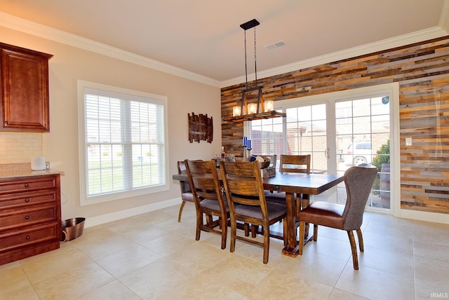 dining space featuring wooden walls, light tile flooring, and a notable chandelier