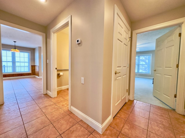 corridor with light tile floors