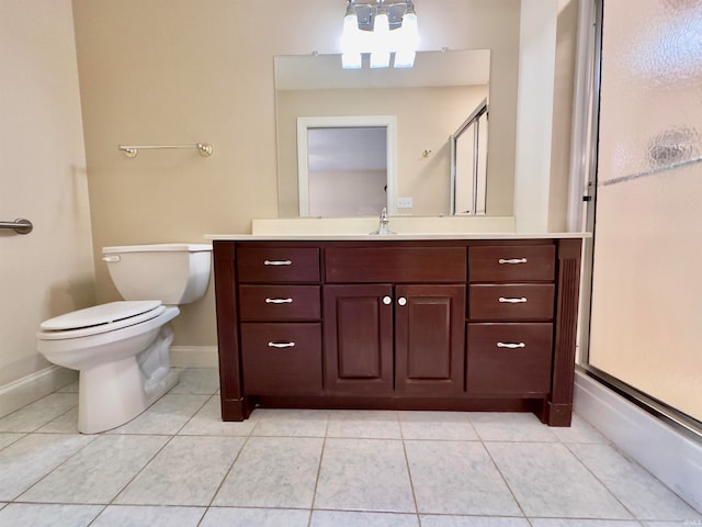 bathroom featuring tile flooring, a notable chandelier, toilet, and vanity