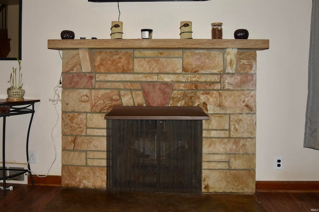 room details with a fireplace and wood-type flooring