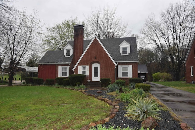 cape cod home with a front lawn