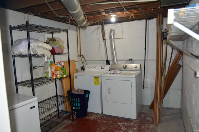 clothes washing area featuring independent washer and dryer