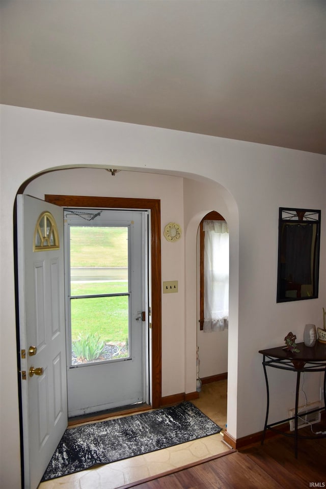 foyer entrance with hardwood / wood-style floors